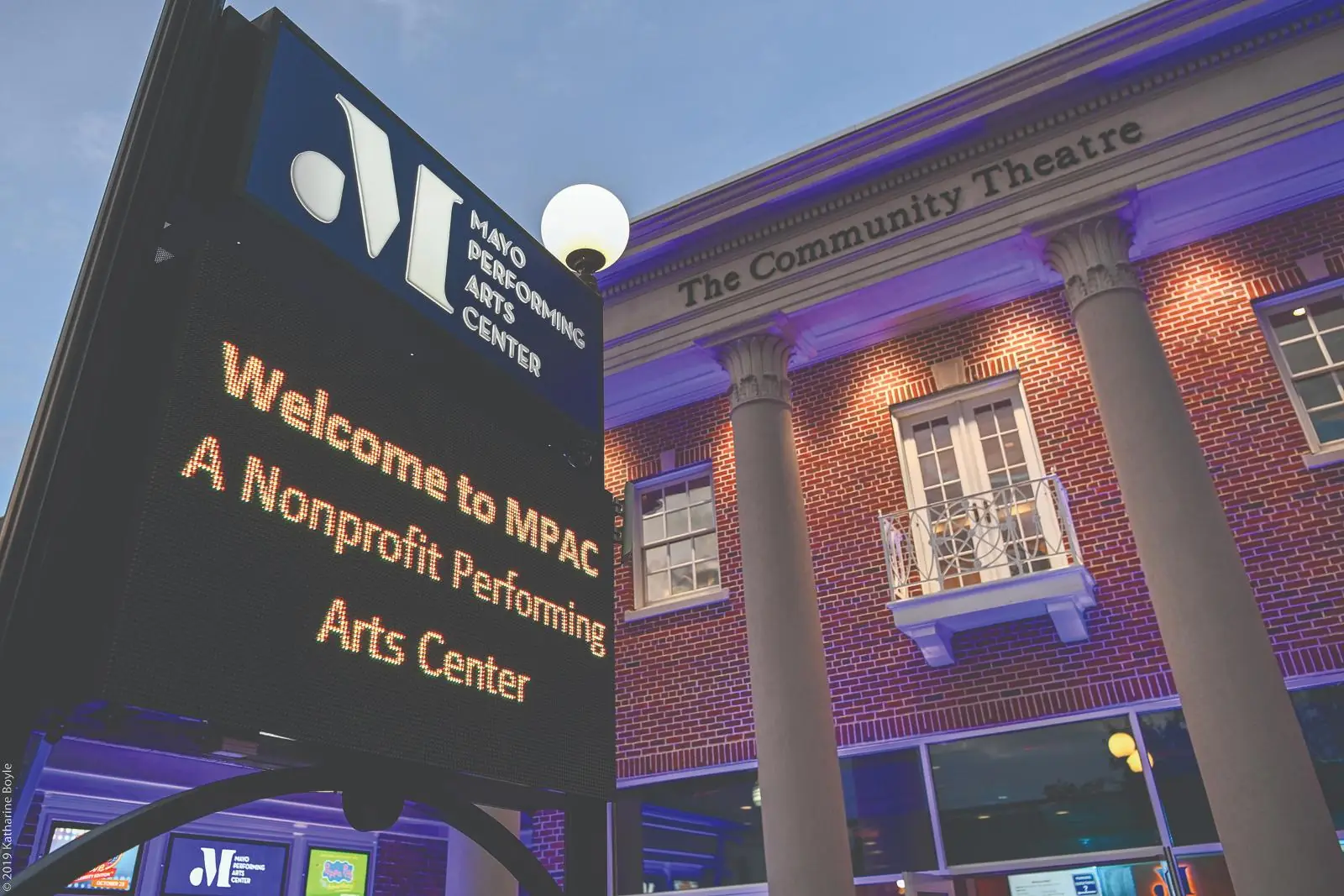 Exterior of the Mayo Performing Arts Center in Morristown at dusk with its illuminated sign